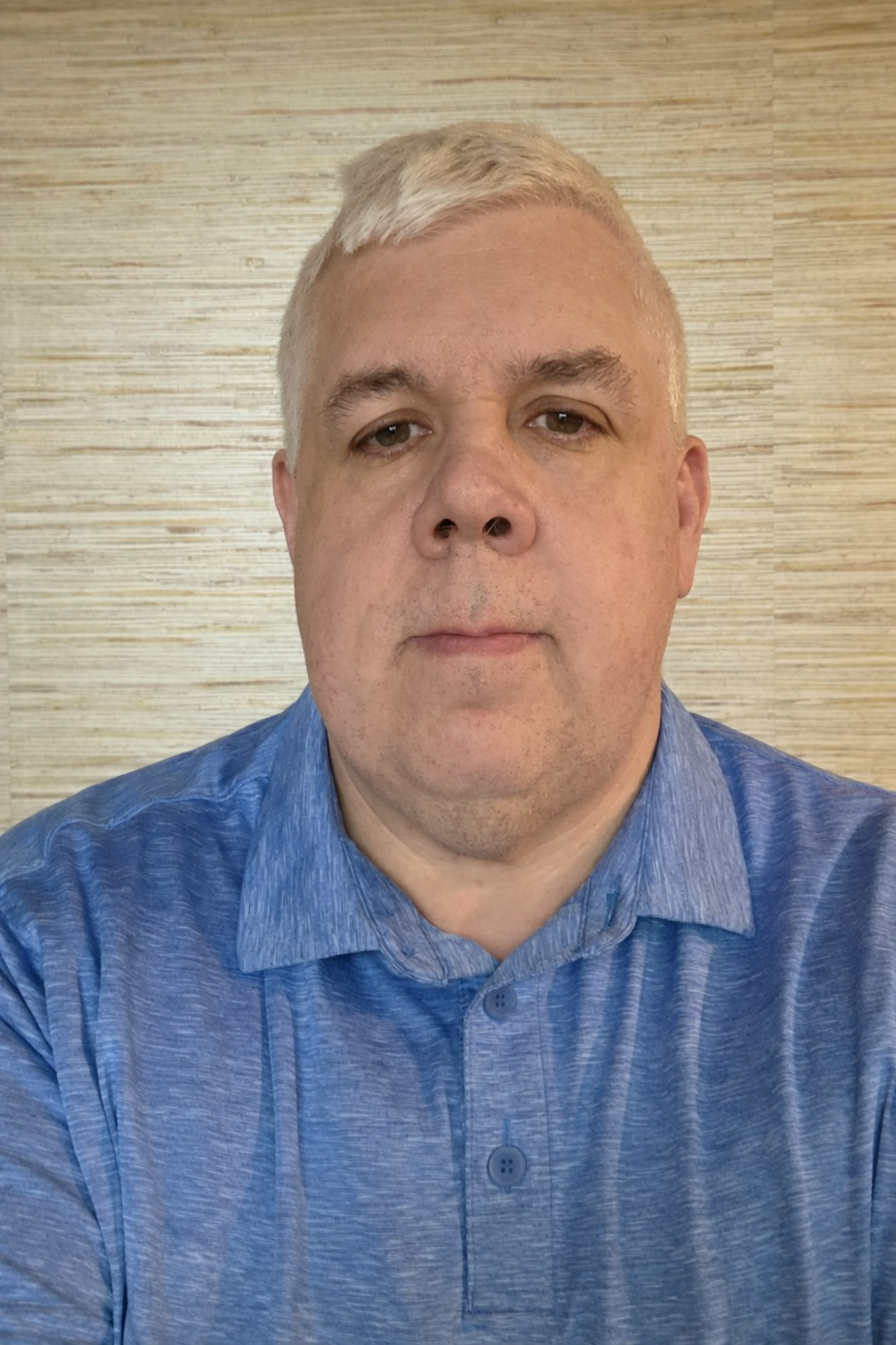 Professional headshot of a person in business attire